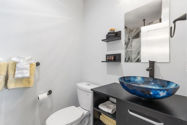 bathroom with toilet and vanity