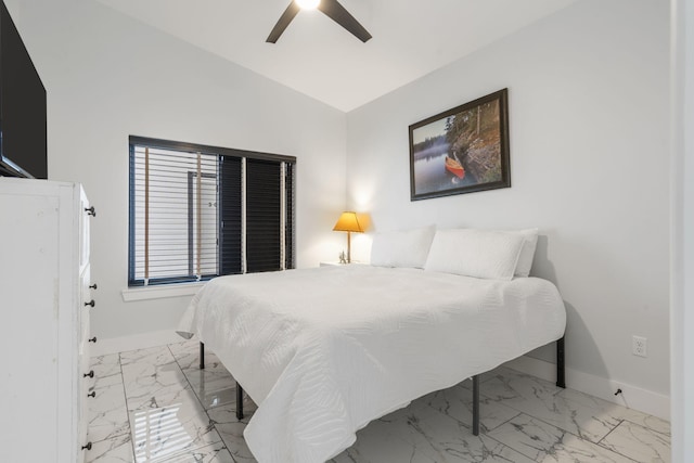 bedroom featuring marble finish floor, ceiling fan, baseboards, and vaulted ceiling