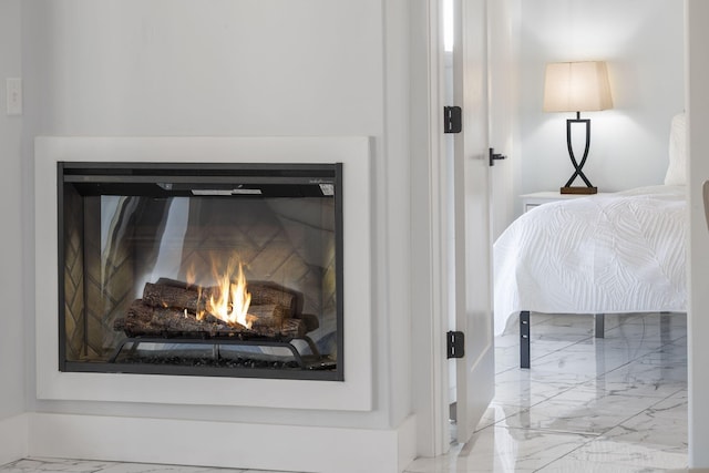 details with a lit fireplace