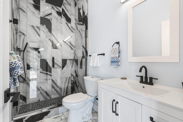 full bathroom with marble finish floor, a marble finish shower, vanity, and toilet