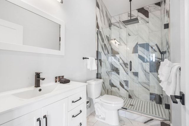 bathroom with toilet, marble finish floor, a shower stall, and vanity