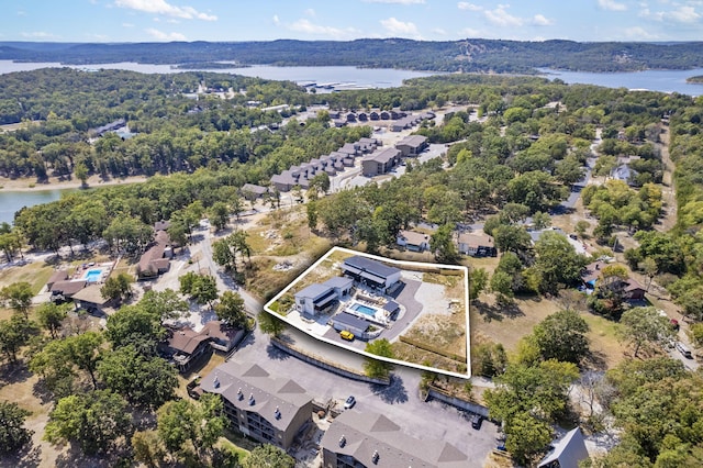 birds eye view of property featuring a residential view and a water view