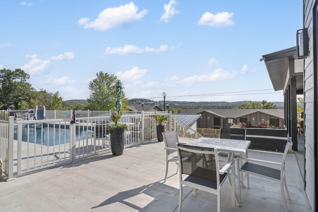 view of patio / terrace with a fenced in pool and fence
