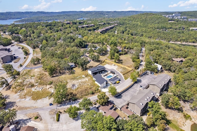 drone / aerial view featuring a view of trees