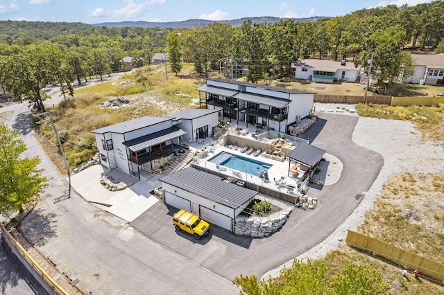 drone / aerial view featuring a view of trees