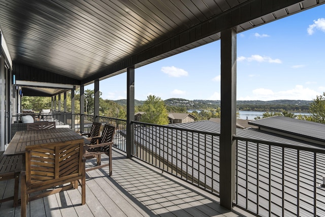 wooden terrace with a water view