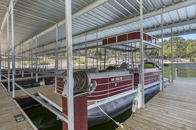 view of dock with a water view and boat lift