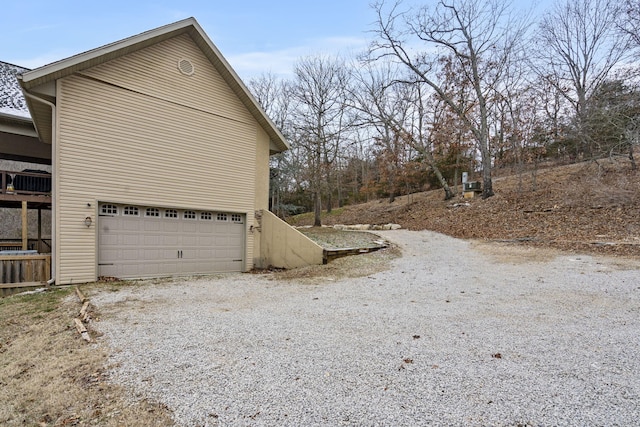 view of side of property featuring a garage