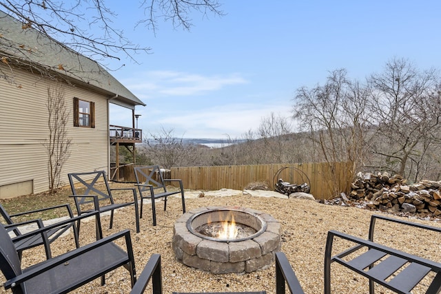 view of yard featuring an outdoor fire pit