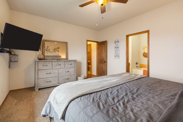 carpeted bedroom with ceiling fan and ensuite bathroom