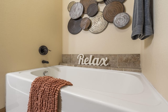 bathroom featuring a washtub