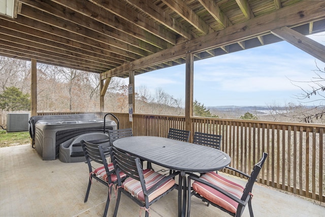 view of patio / terrace with a hot tub