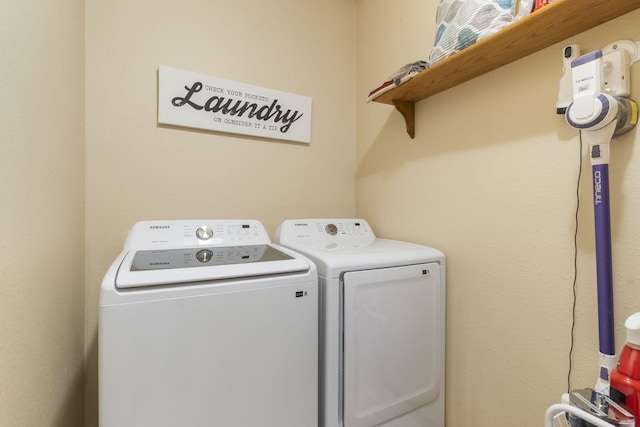 washroom featuring independent washer and dryer