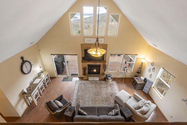 living room with hardwood / wood-style flooring and a high ceiling