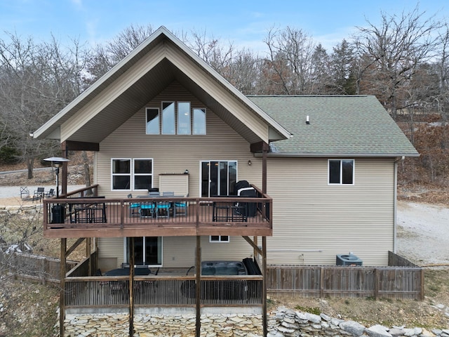 back of house with a wooden deck