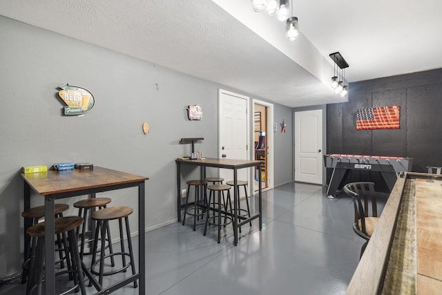 dining room with a textured ceiling