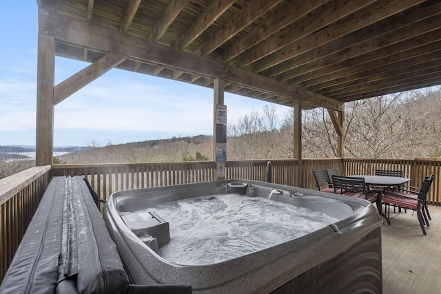 wooden terrace featuring a hot tub