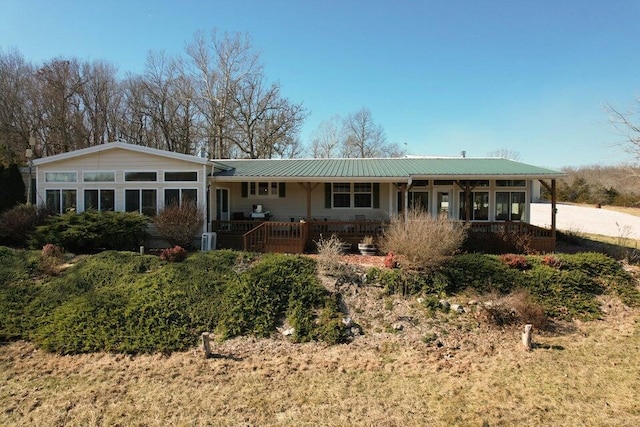 view of front of house with a sunroom