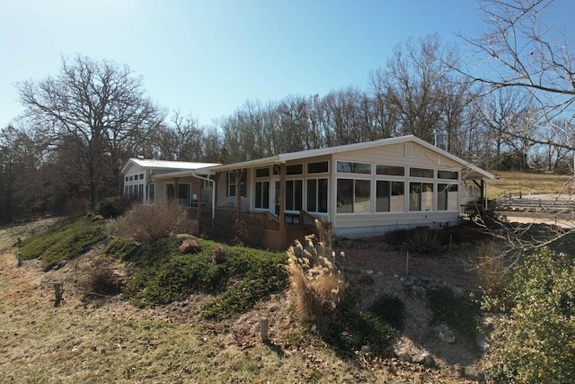 view of front facade featuring a sunroom