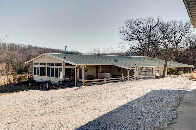 view of front facade featuring a sunroom