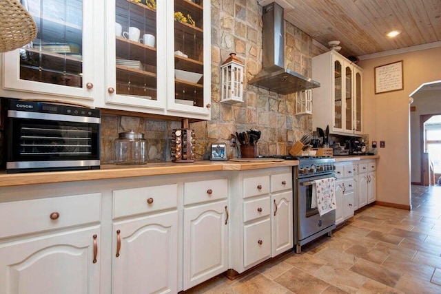 kitchen featuring appliances with stainless steel finishes, white cabinetry, backsplash, wooden ceiling, and wall chimney exhaust hood