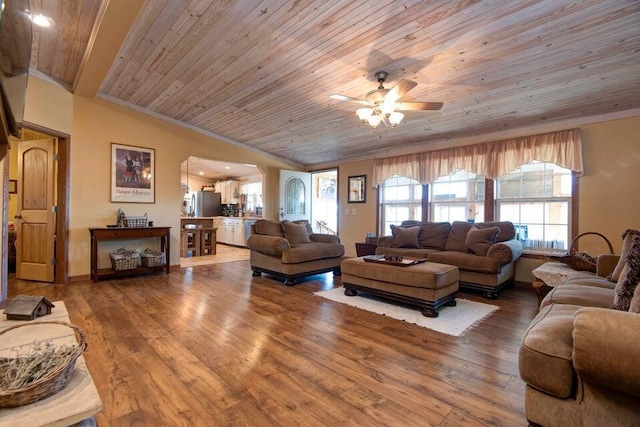 living room with lofted ceiling, crown molding, ceiling fan, wood-type flooring, and wooden ceiling