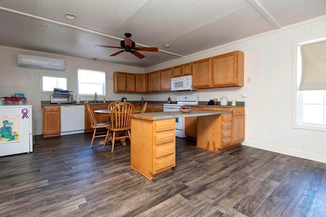 kitchen with white appliances, a breakfast bar area, dark hardwood / wood-style floors, a kitchen island, and an AC wall unit