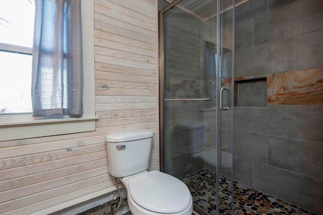 bathroom with toilet and walk in shower