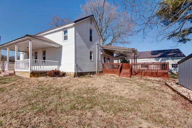 view of home's exterior featuring a yard and covered porch