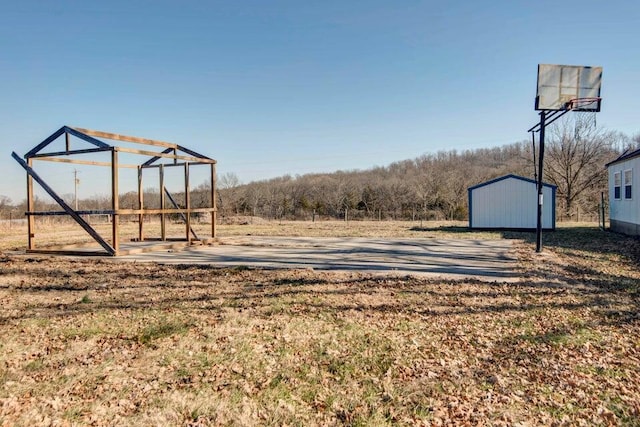 view of yard featuring basketball court