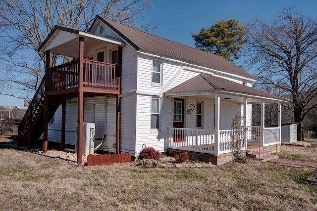 view of front of property with a porch and a front yard