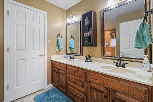 bathroom featuring tile patterned floors and vanity