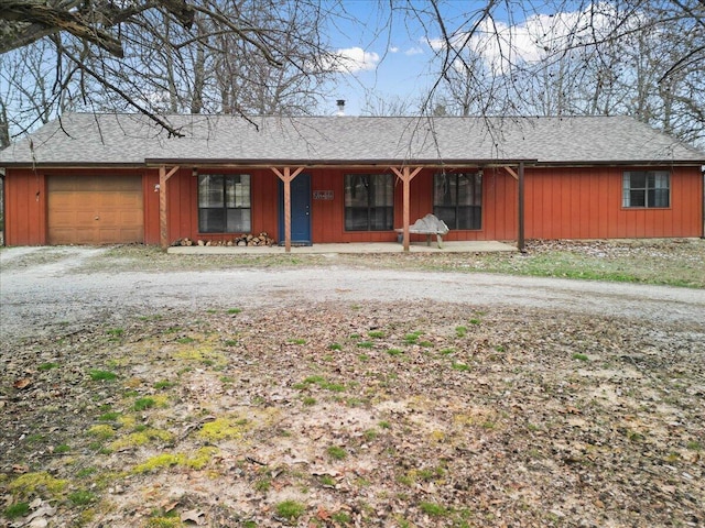 single story home with a garage