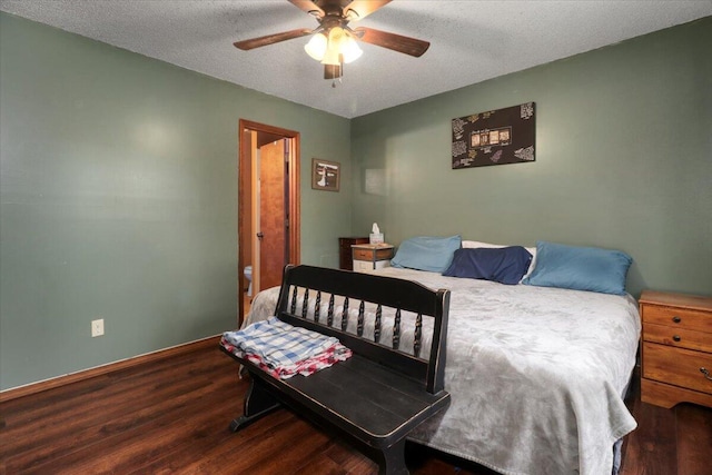 bedroom with hardwood / wood-style floors, ceiling fan, and a textured ceiling