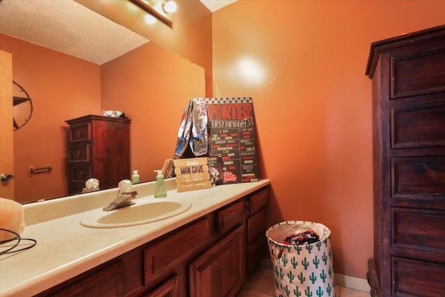 bathroom with tile patterned flooring and vanity