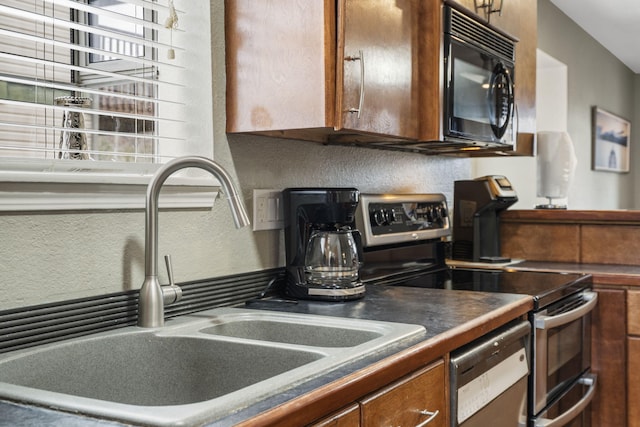 kitchen featuring stainless steel appliances and sink