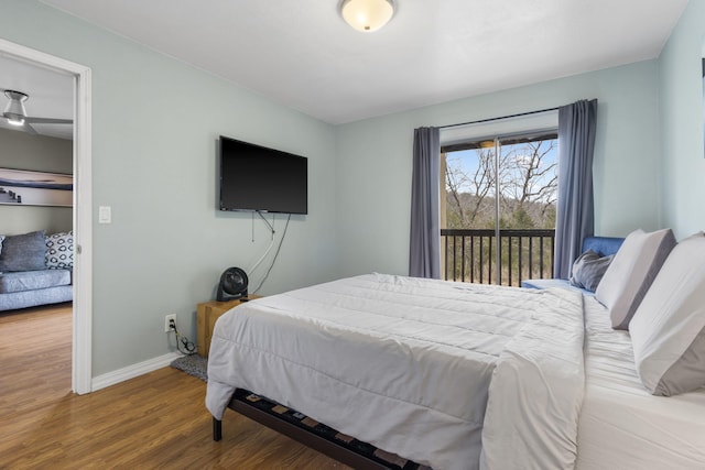 bedroom featuring hardwood / wood-style floors and access to outside