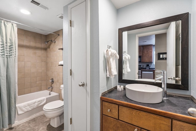 full bathroom with tile patterned flooring, vanity, toilet, and shower / bath combo with shower curtain