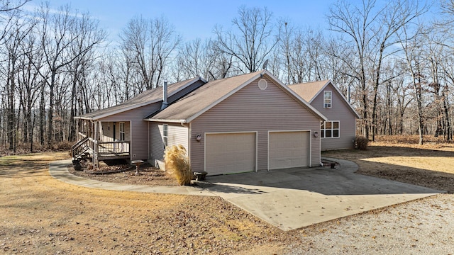 view of property exterior featuring a garage