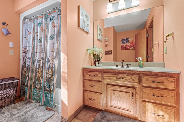 bathroom featuring tile patterned flooring, vanity, and shower / bath combo