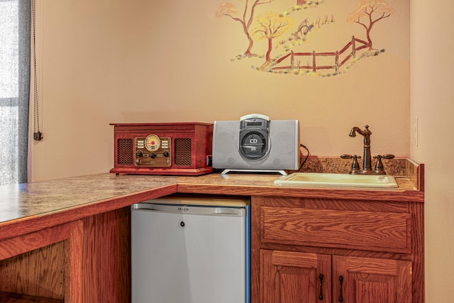 interior space featuring sink and fridge