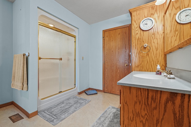 bathroom with vanity and walk in shower