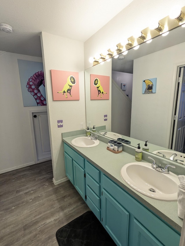 bathroom featuring vanity and hardwood / wood-style flooring