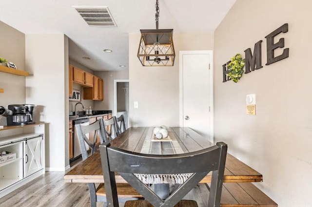 dining space featuring light wood-type flooring