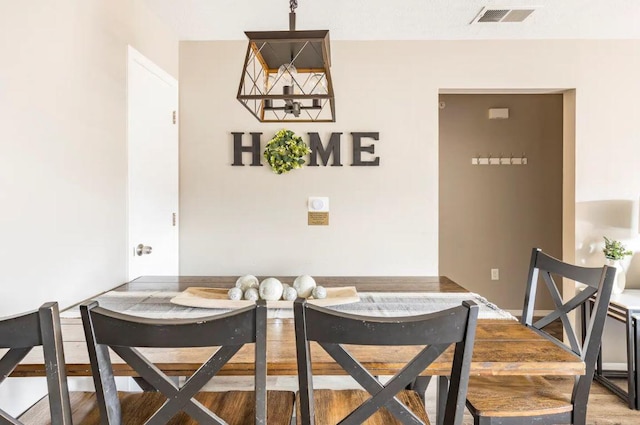 dining space featuring hardwood / wood-style flooring