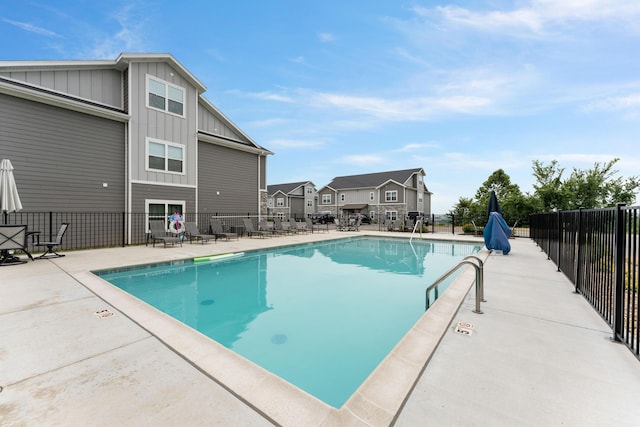 view of swimming pool featuring a patio area