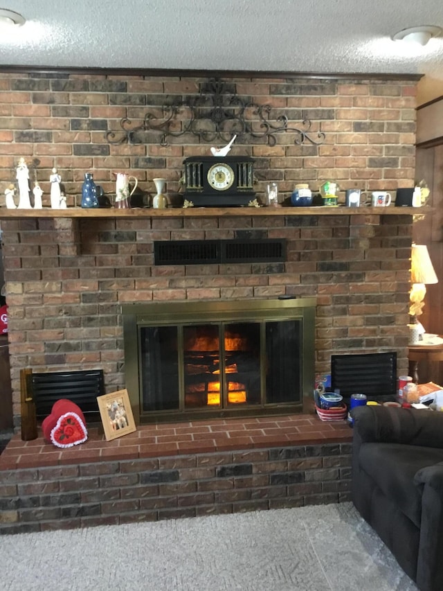 details with a fireplace, a textured ceiling, and carpet flooring