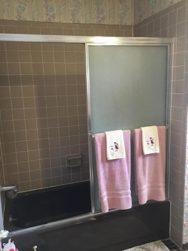 bathroom featuring enclosed tub / shower combo