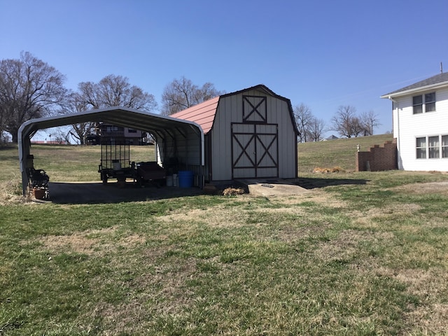 view of outbuilding with a detached carport, an outdoor structure, and driveway