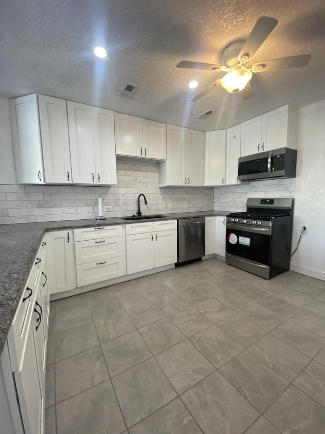 kitchen featuring sink, white cabinetry, and stainless steel appliances